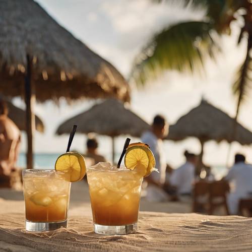 Drinks being served in a thatched beach bar on a Caribbean beach.