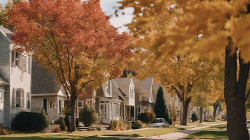 Uma fileira de casas em um bairro suburbano com árvores exibindo uma profusão de cores de outono.