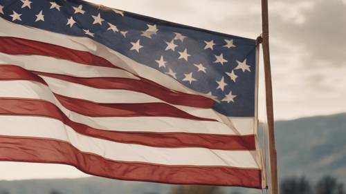 Amerykańska flaga powiewająca dumnie w wietrzny dzień na farmie
