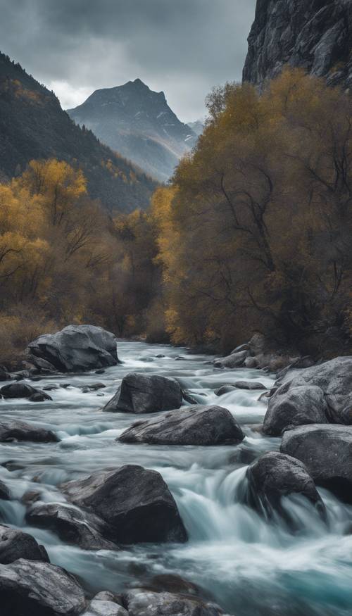 一条蓝色的野河奔腾穿过灰色的岩石山脉，形成一幅美丽的风景。