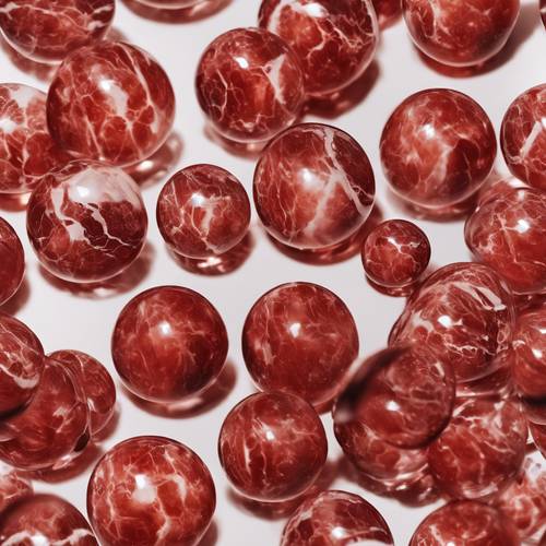 An image of a clear red marble against a stark white background. Tapet [6a9ec3a9c39e491fb690]