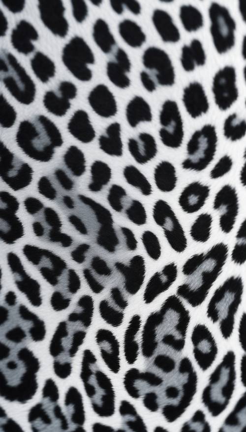 Primer plano de una textura de estampado de leopardo gris sobre una superficie de alto brillo.