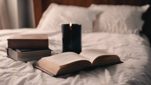 A dog-eared copy of a romantic novel, sitting on an emo girl's bedside table beside a black candle.