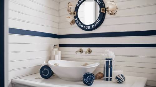 Kamar mandi bertema bahari dengan garis-garis putih dan biru tua, dekorasi kerang, dan cermin berbentuk jendela kapal.
