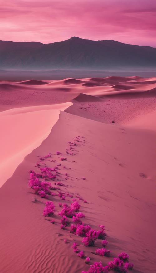 Rozległy pustynny krajobraz z różowymi wydmami pod magentowym niebem.