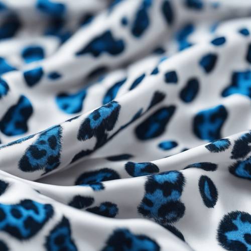 Blue leopard print on satin fabric blowing in the wind