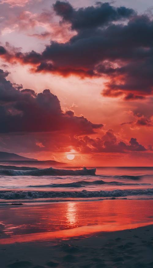 Яркий закат на пляже, оттенки прохладного синего, смешивающиеся с огненно-красным в небе.