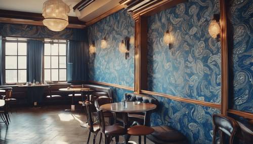 A blue paisley wallpaper in a retro-themed café.