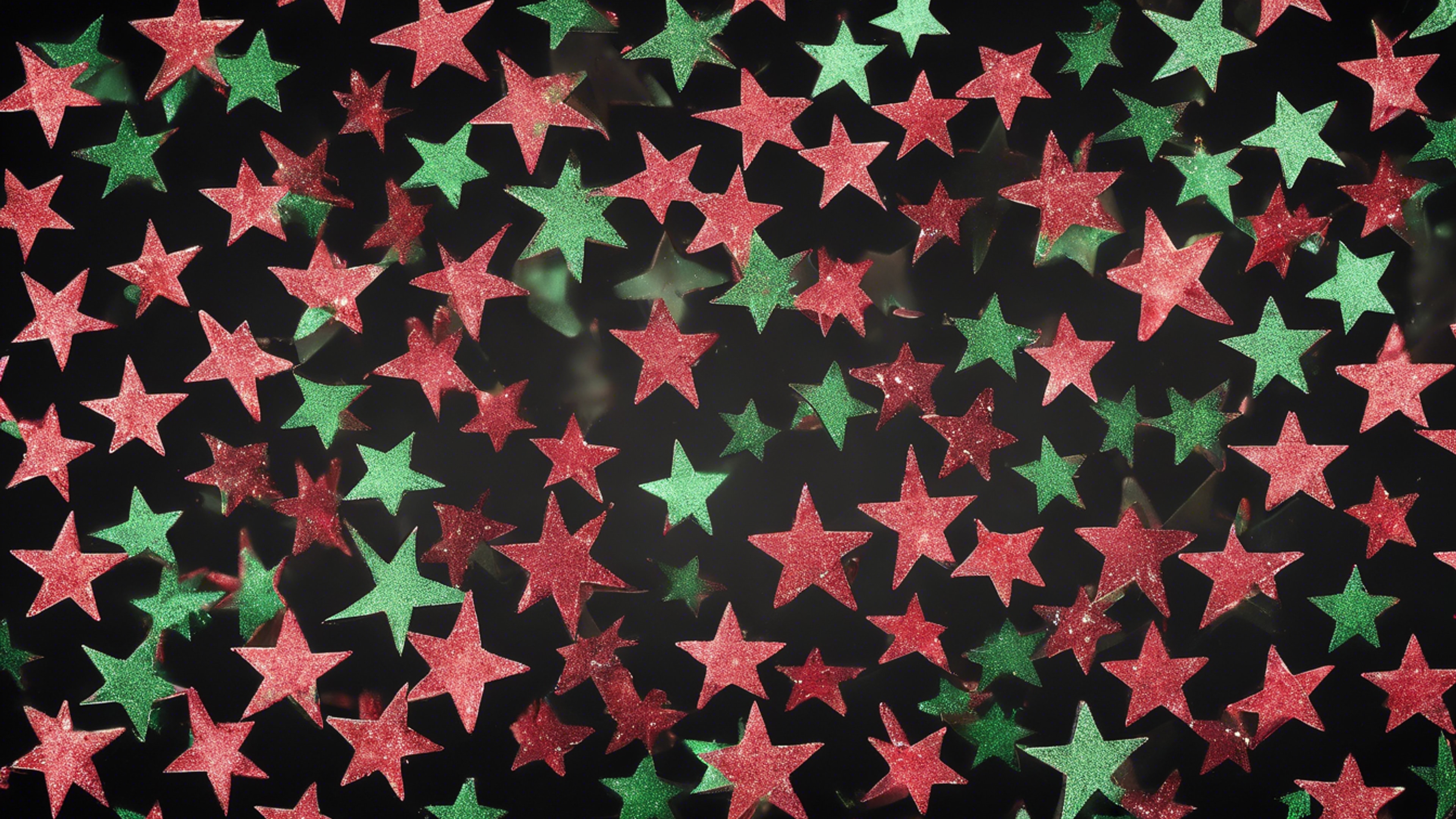 Green and red glitter forming star shapes on a black background Обои[2fe752b5dc5f4f35ba35]