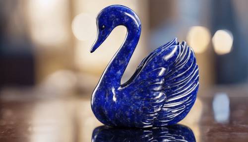 A finely carved sculpture of a swan, made from a single piece of brilliant blue lapis lazuli. Tapet [1ae25ba748454b87a81f]