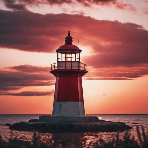 Samotna latarnia morska stojąca na tle jasnoczerwonego zachodu słońca.