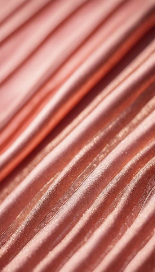 Крупный план тонких полосок из розового золота на богатой коралловой ткани.