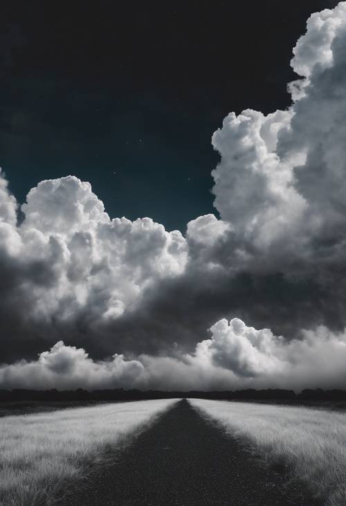 Nuages ​​blancs formant un chemin à travers un ciel noir.