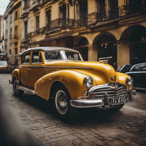 A vintage car painted in a rich, dark yellow colour.