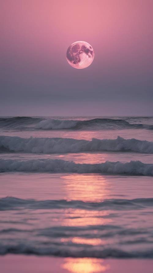 Ein rosa Mond, der über einem ruhigen und stillen Ozean aufgeht.