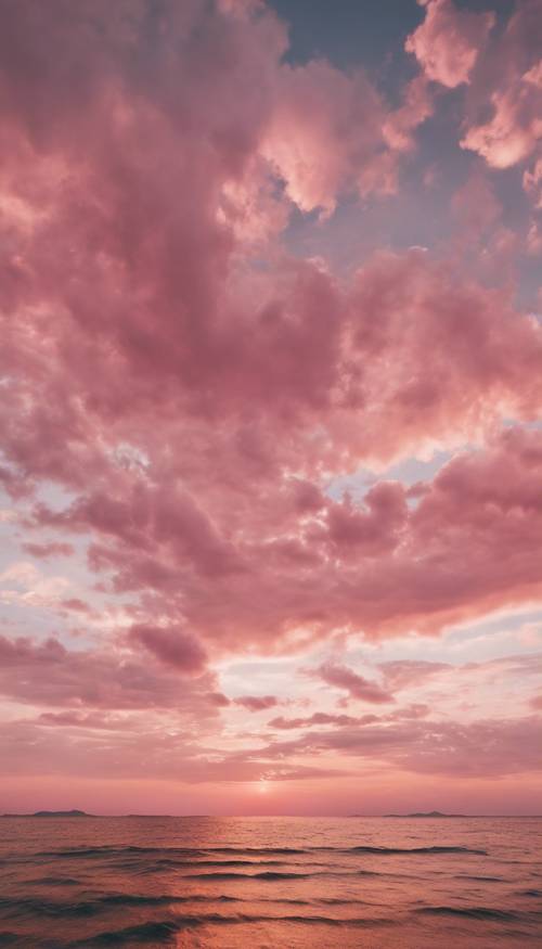 Um céu rosa ao pôr do sol com nuvens brancas fofas espalhadas pelo horizonte.