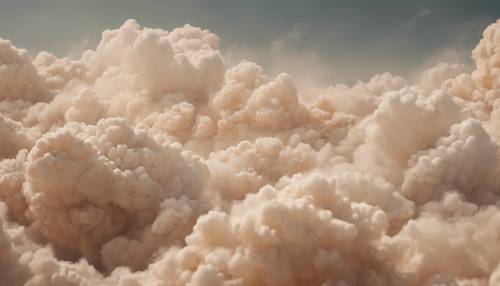 Lienzo del artista con capas vibrantes de formas similares a nubes en tonos bronceados para lograr un efecto de ensueño.