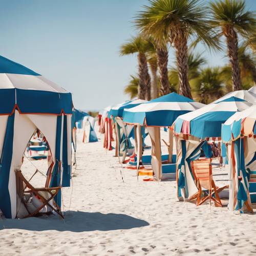 一系列的海灘帳篷和遮陽傘為明媚的夏日早晨的白色沙灘增添了活力。