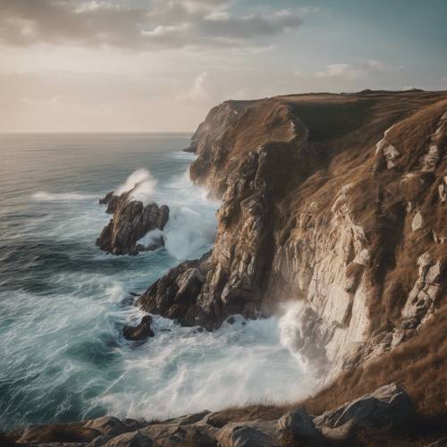 A breathtaking seaside cliffs view with waves crashing into the rocks.