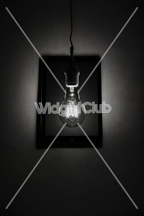 Light Bulb Glowing on a Digital Tablet Tapet [136409c39a8e40d6bafd]