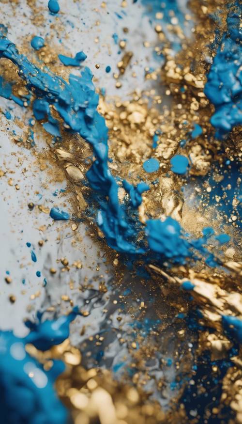 Pola percikan cat abstrak menampilkan warna emas dan biru yang berinteraksi satu sama lain.
