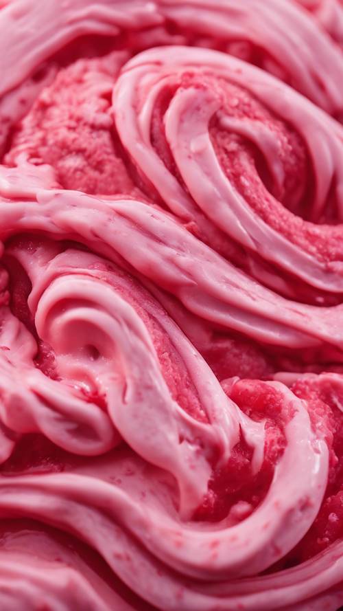 A tantalizing close-up of a swirl of red and pink gelato.