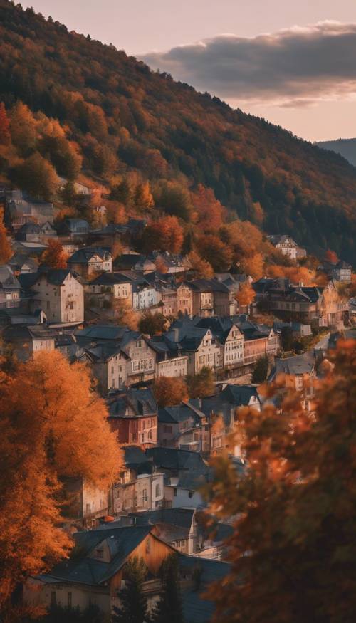 一座风景如画的小镇坐落在山脚下，秋天黄昏时分，树叶变色。