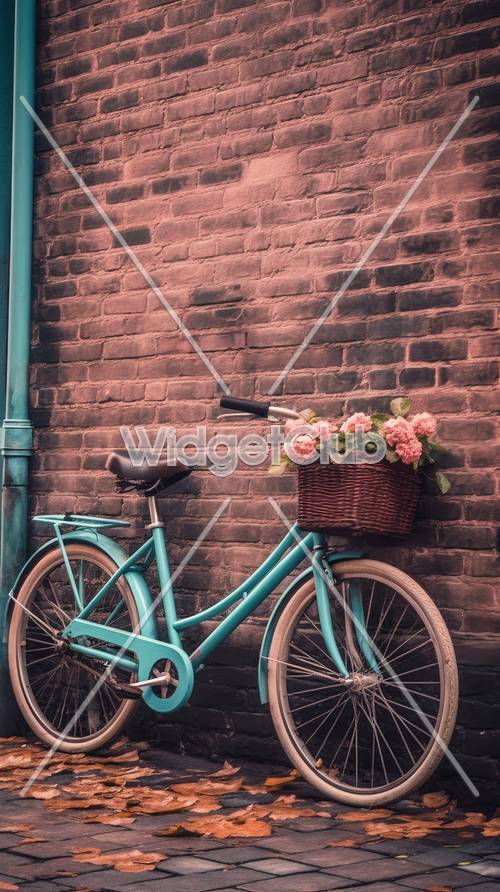 花のかごをつけた自転車とレンガの壁の壁紙