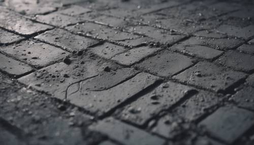 Macro shot of dark grey concrete surface with prominent details.