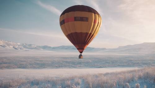 A hot air balloon floating over a vast snowy landscape.