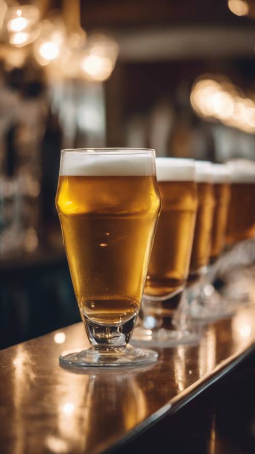 A french brasserie with tall glasses of frothy beer on the counter.