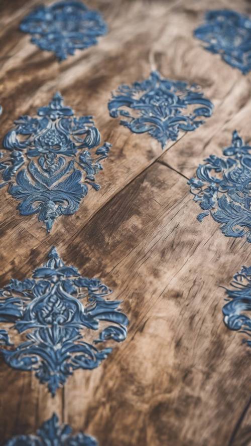 An antique blue damask tablecloth spread on a hand-carved wooden table.