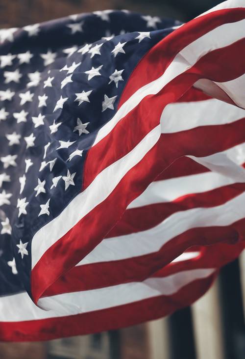 Un drapeau américain flottant au vent avec ses rayures blanches bien visibles.