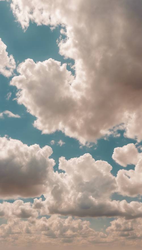 An expansive sky with scattered small, light beige clouds.