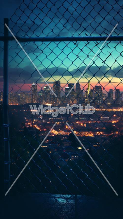 Colorful City Skyline Through a Fence at Sunset
