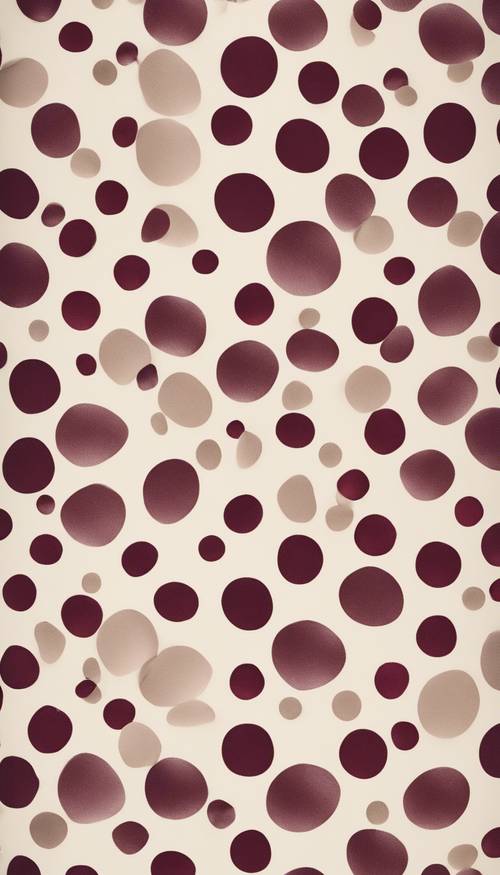 An antique wallpaper design featuring burgundy polka dots on an eggshell white surface.