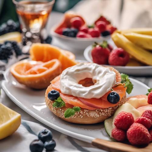A bagel with lox and cream cheese served with a side of fresh cut fruits.
