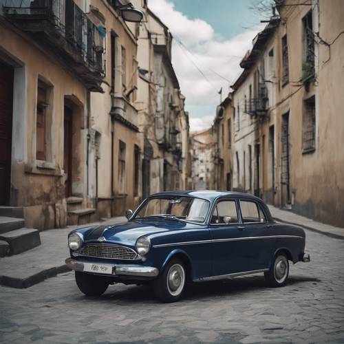 An old dark blue vintage car parked on a deserted street.