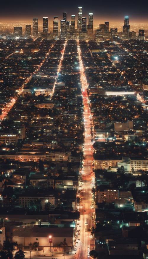 An overview night scene of Los Angeles illuminated with thousands of bright lights.
