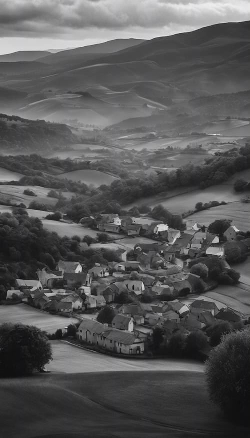 A grayscale landscape of a peaceful village nestled amongst rolling hills under a cloudy sky.