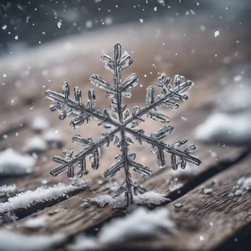 A delicate snowflake lying isolated on a vintage wooden surface, reflecting the beauty of winter.