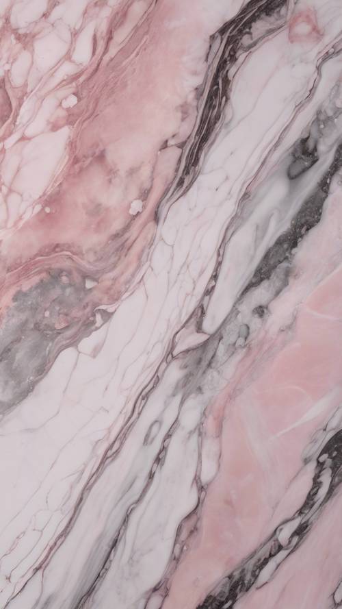 Una vista de primer plano del mármol rosa, que revela tonos sutilmente diferentes de rosa, gris y blanco.