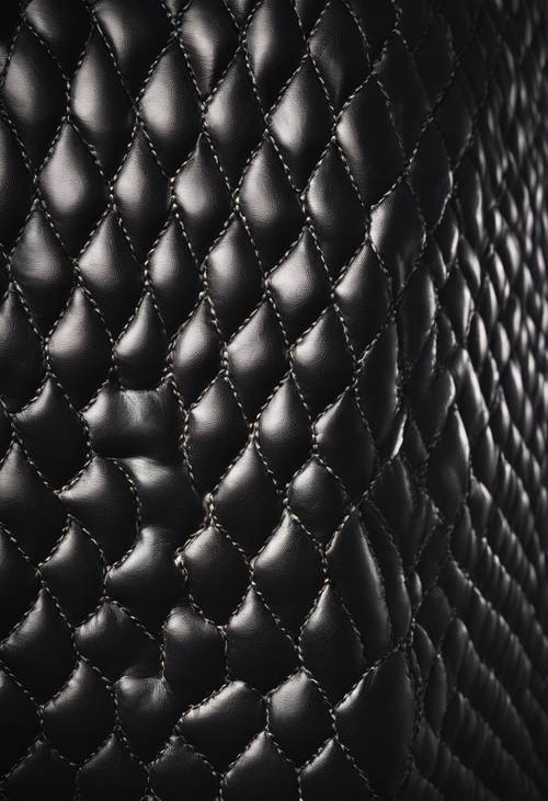 Elegant, dark, leather surface with a distinctive diamond stitch pattern. Wallpaper [3a31e42ab2524d249010]