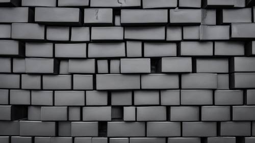 多块闪亮的黑色砖块以有序的图案堆叠在一起。