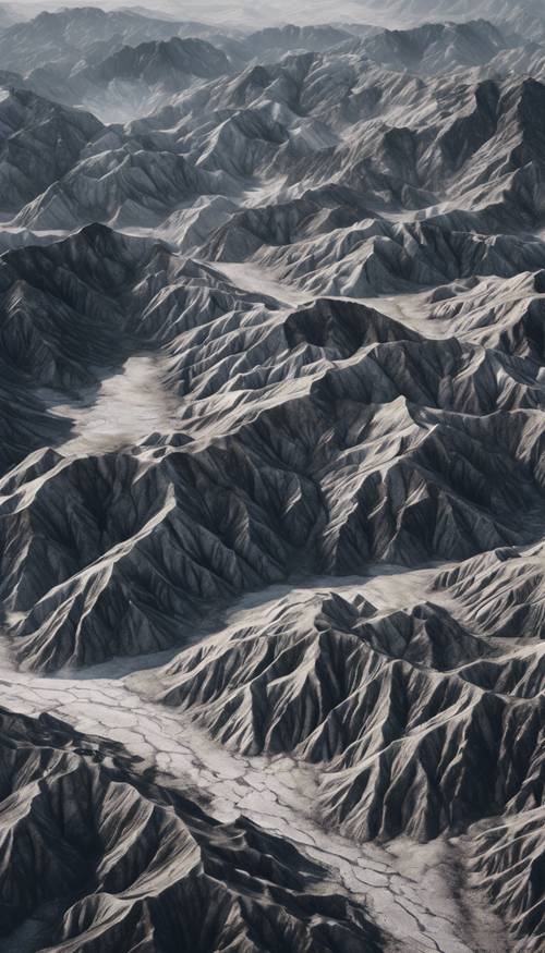 Vista aérea de una cadena montañosa que se asemeja al mármol veteado de negro y plata.