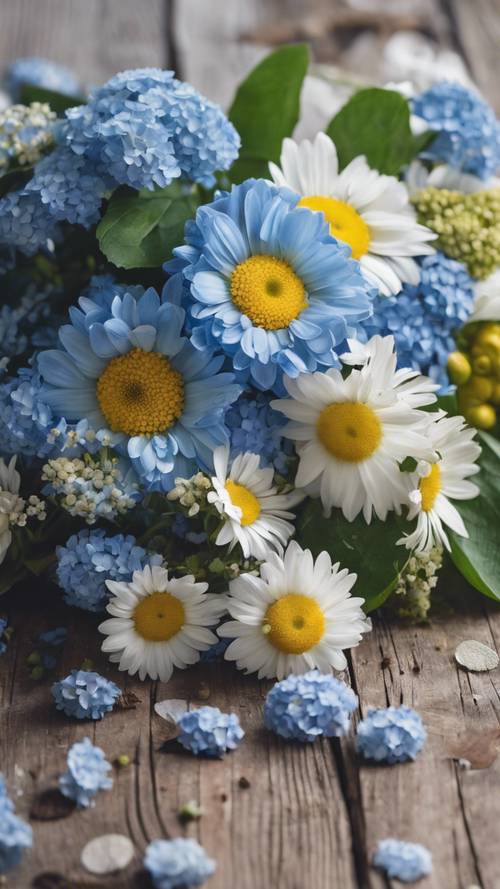A bouquet of bright daisies and blue hydrangeas on a rustic wooden table.