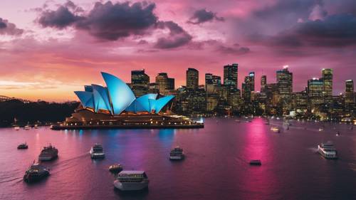 An aerial view of the Sydney skyline, the Opera House reflecting the vibrant colors of a spectacular fireworks show.
