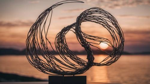 Минималистская абстрактная скульптура из проволоки с витыми линиями на фоне восхода солнца.