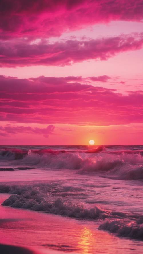 Matahari terbenam berwarna merah muda cerah di atas pantai yang tenang, dengan ombak kecil menerpa pantai.