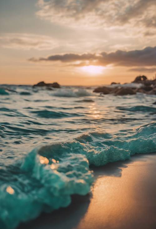 A serene beach scene with teal ombre waves during sunset. Wallpaper [52d5ca2a9e6b46f38385]